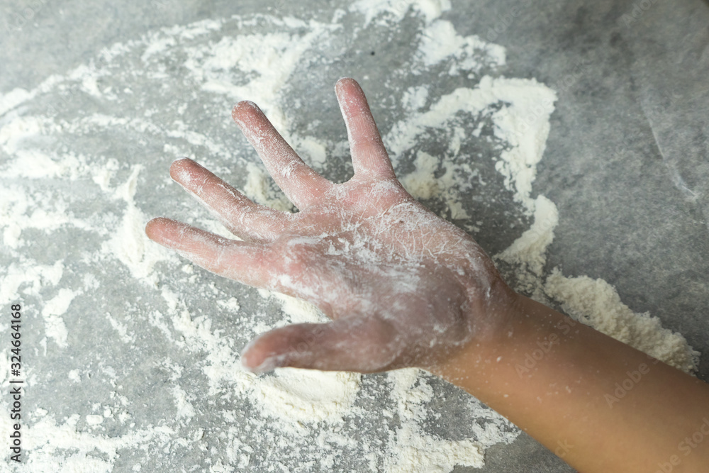 Fototapeta premium Hands in flour. Homemade cake. Cooking in the kitchen.
