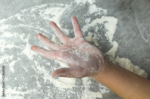 Hands in flour. Homemade cake. Cooking in the kitchen.