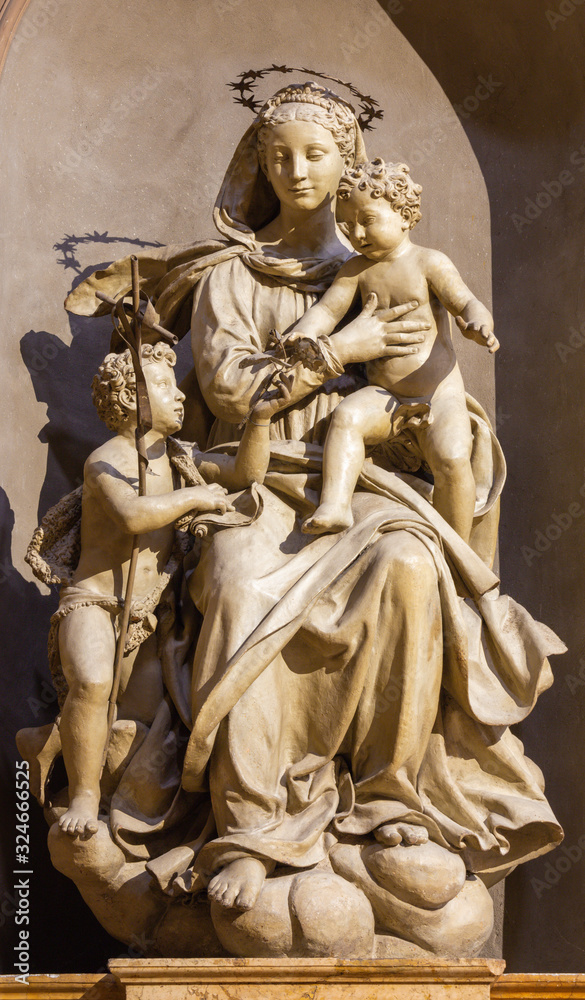 PARMA, ITALY - APRIL 15, 2018: The carved statue of Madonna with the Child and St. John the Baptist in church Chiesa di San Giovanni Evangelista by  Antonio Begarelli (1543).