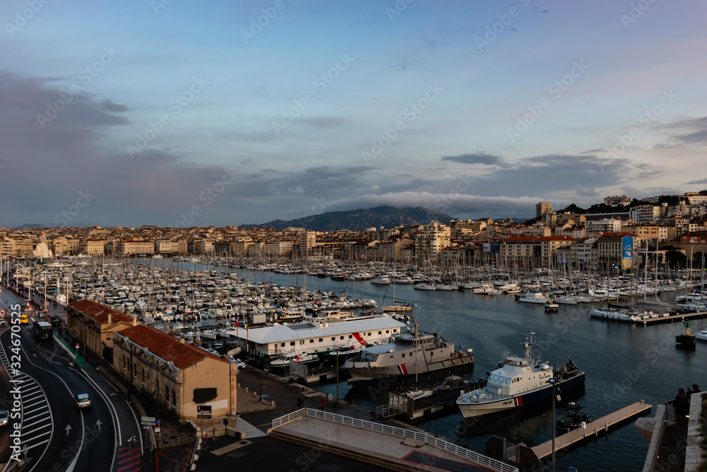 Marseille, France - January 25, 2020: the view of the old port (Vieux Port) at sunset