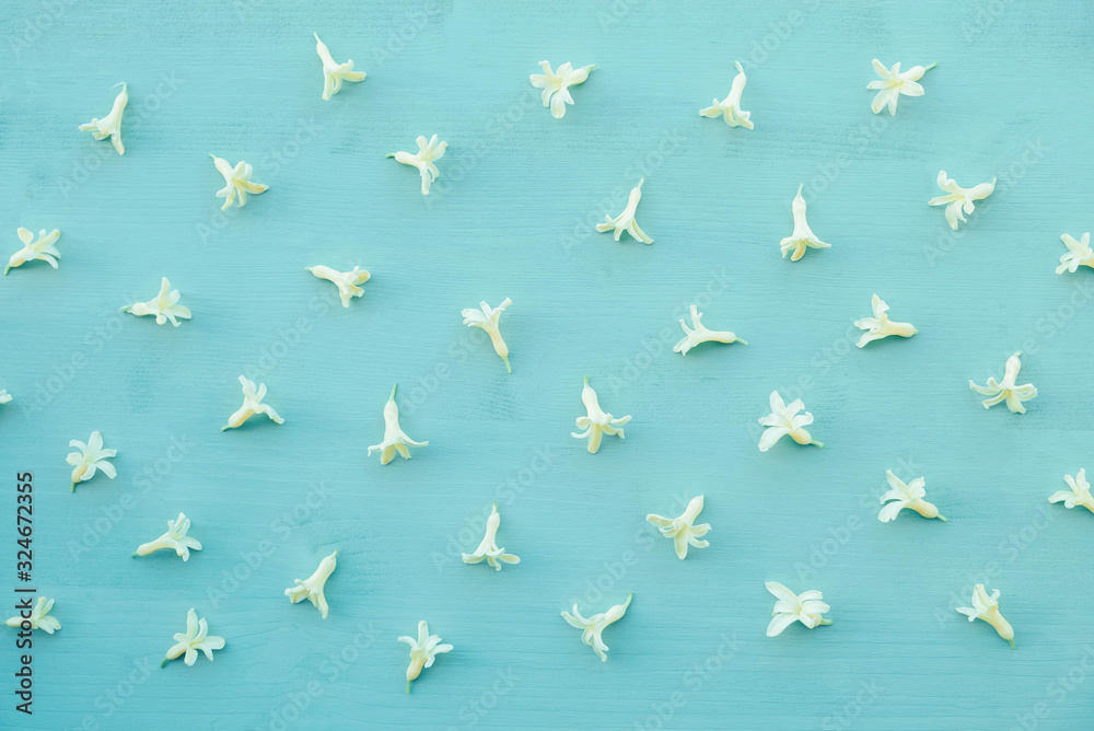 Beautiful fresh yellow hyacinth petals on pastel light blue wooden background. Beautiful fresh yellow hyacinth petals on pastel light blue wooden background.