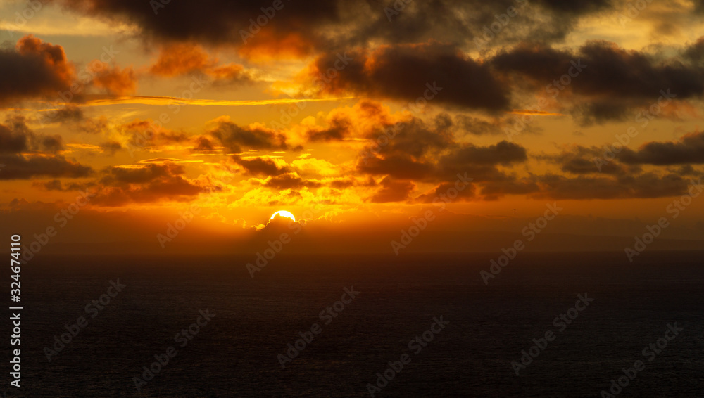 A dramatic sunrise over the Pacific Ocean from the Hawaiian islands.