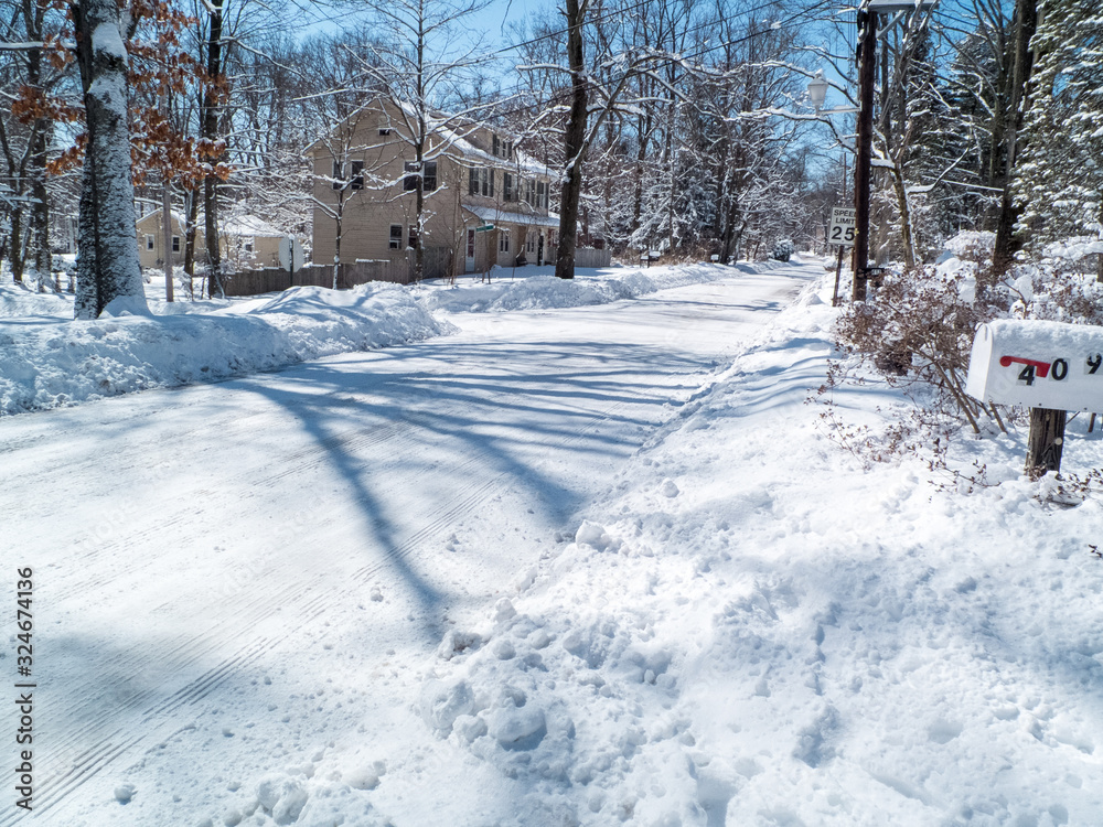 Naklejka premium county road in winter wonderland the day after the snow storm