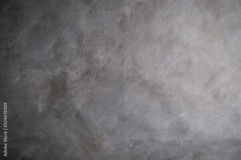 Abstract grunge stained canvas texture. Grey artistic background.