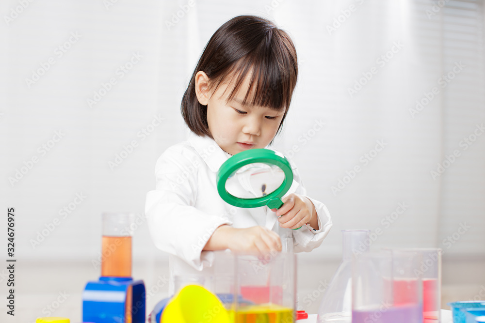 toddler girl pretend play scientist role at home against white background toddler girl pretend play scientist role at home against white background