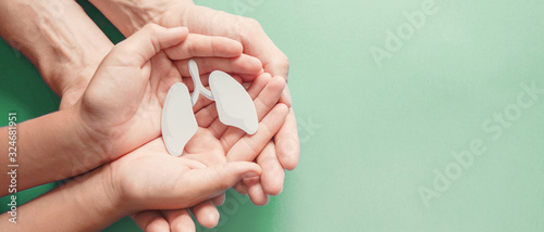 Photography Adult and child hands holding lung, world tuberculosis TB day, lung cancer, resp