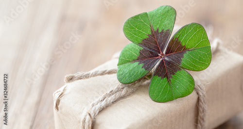 paper gift with lucky clover photo