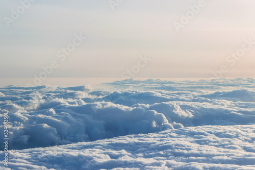 sunshine on stratosphere cloud at sunset outside airplane  © cceliaphoto