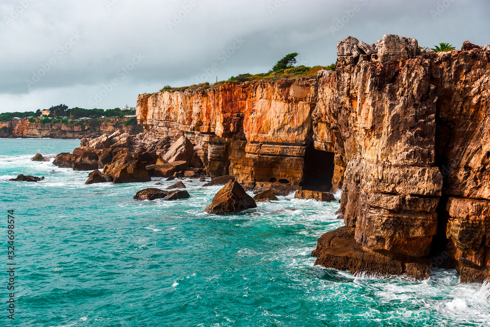 Rocky cave and Atlantic Ocean coastline. Amazing view at Boca do Inferno, Hell's Mouth – Cascais, Portugal