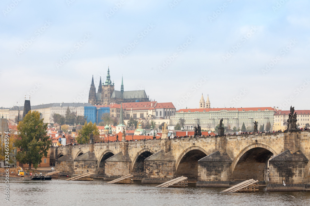 Charles bridge (Karluv Most) and the Prague Castle (Prazsky hrad) seen from the Vltava river. The castle is the main touristic landmark of the city