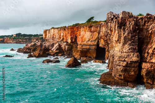 Rocky cave and Atlantic Ocean coastline. Amazing view at Boca do Inferno, Hell's Mouth – Cascais, Portugal