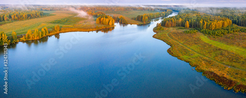 Sunset aerial atmospheric view on river in Ural Russia. Drone photography