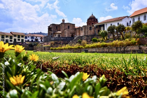 Beautiful scenery of a garden in front of the Qorikancha Cusco in Peru photo