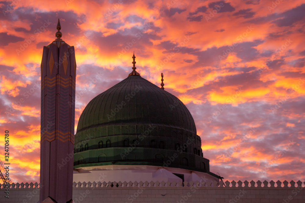 Naklejka premium Al Masjid an Nabawi mosque beatuful sunset cloudy - Medina Saudi Arabia 6 jan 2020