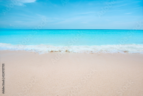 Soft Blue Ocean Wave On Sandy Beach. View of nice tropical beach. Holiday and vacation concept. Tropical beach.