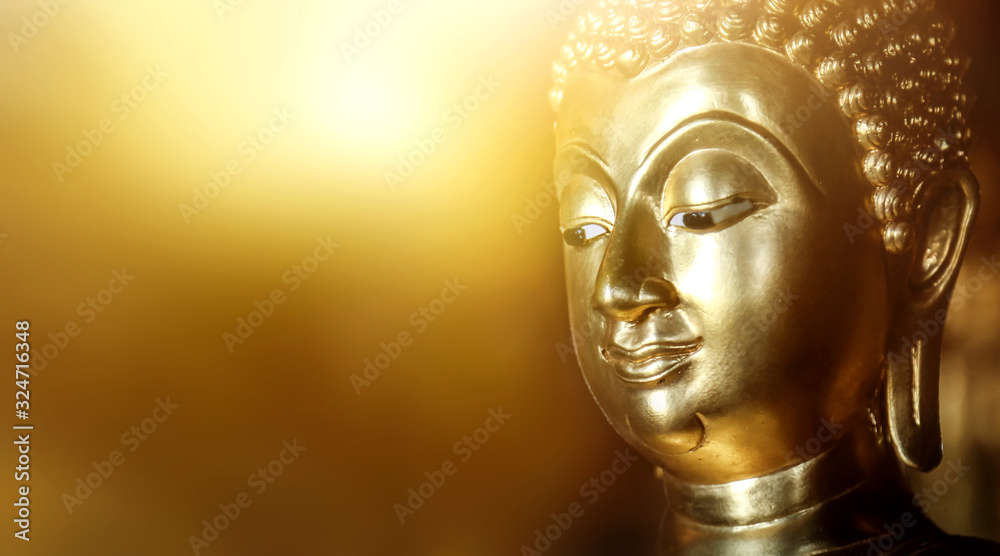 Fototapeta The background of the Buddha is energetic, mysterious and beautiful. Some Buddha images that emerge from darkness and light. Leave space for placing characters.