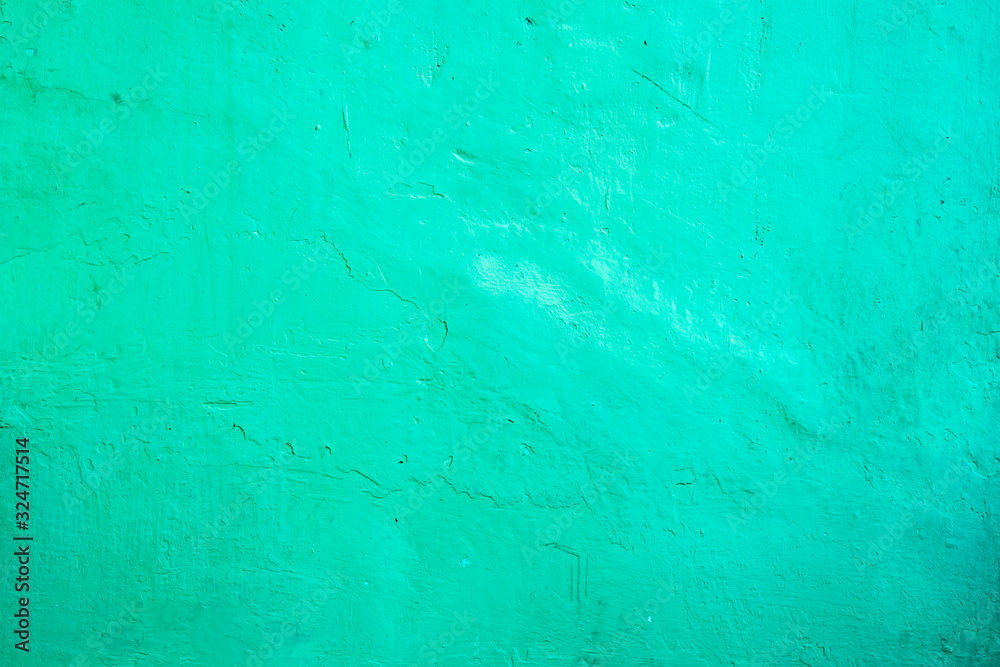 Rustic bright green concrete walls background. Aqua menthe color.