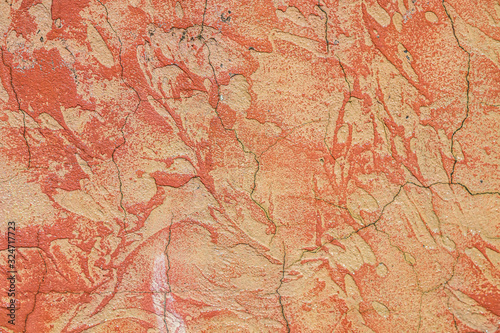Cement putty painted wall with cracks as a background