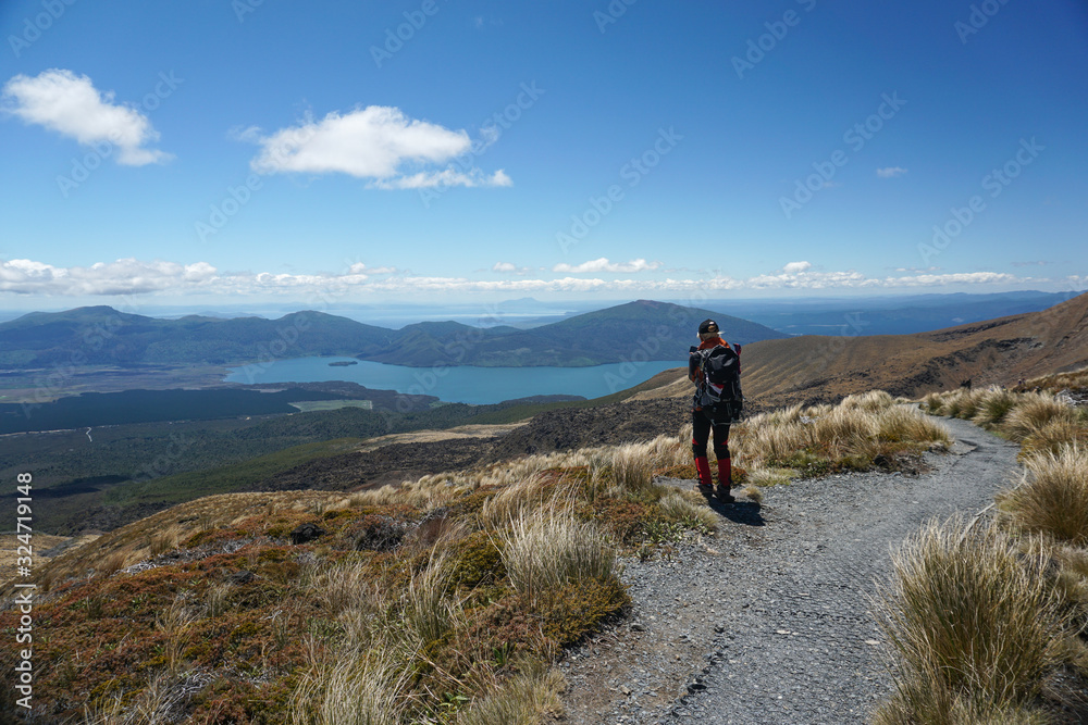 Tongariro, New Zealand - December 27, 2019 : Woman Trekking at Tongariro Alpine Crossing in New Zealand