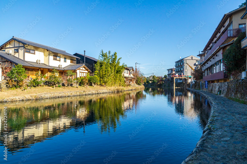 Riverside landscape reflection on the river, Kyoto, Japan Riverside landscape reflection on the river, Kyoto, Japan