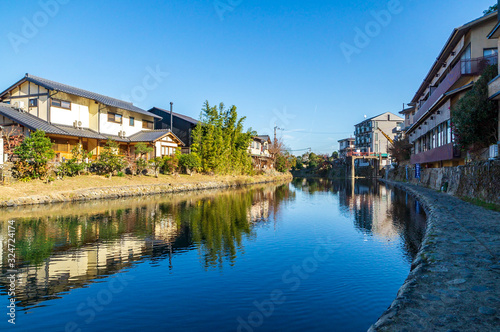 Riverside landscape reflection on the river, Kyoto, Japan © Ben