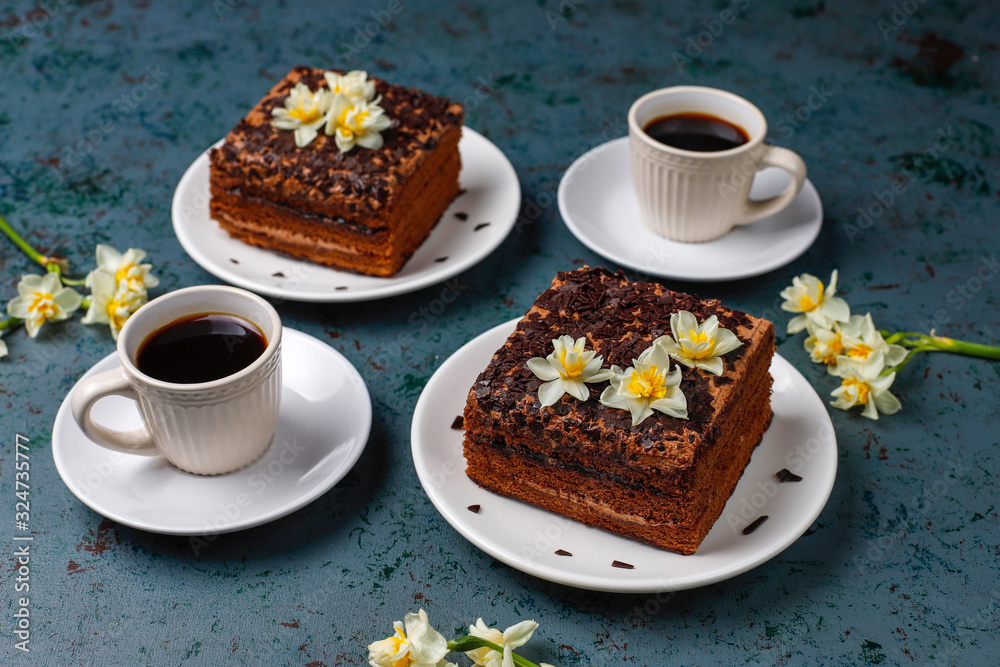 Tasty homemade chocolate truffle cakes with coffee on dark background Tasty homemade chocolate truffle cakes with coffee on dark background