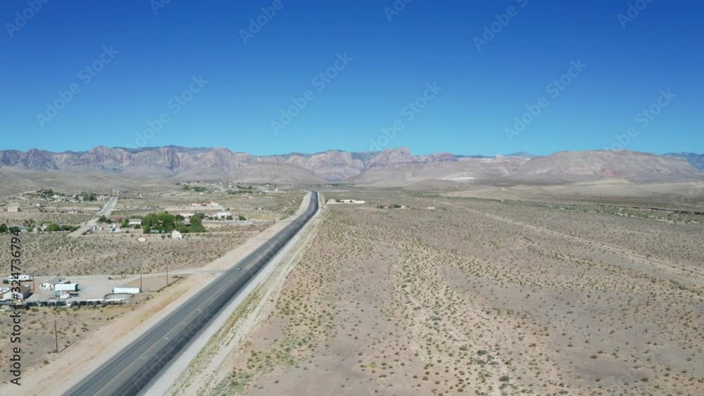 Desert Aerials just outside of Las Vegas, NV showing a desert highway running toward the beautiful Spring Mountains. Desert Aerials just outside of Las Vegas, NV showing a desert highway running toward the beautiful Spring Mountains.