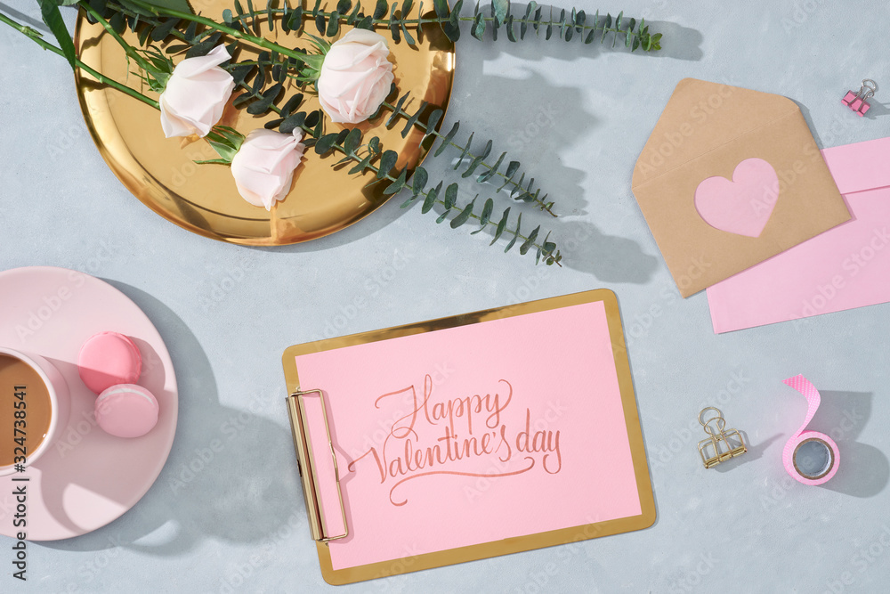 flat lay composition with flowers, a cup o coffee and sweets. Concept valentines day top view