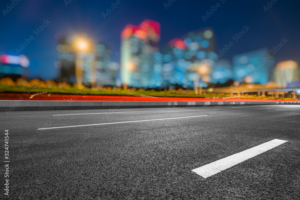 Asphalt highway and modern business district office buildings in Beijing at night, China Asphalt highway and modern business district office buildings in Beijing at night, China
