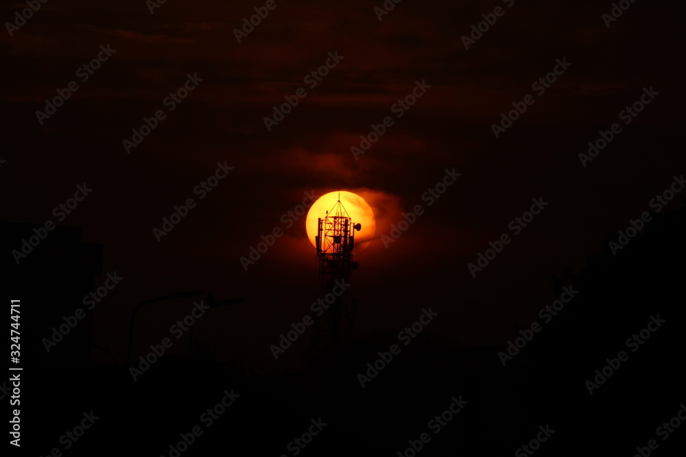 silhouette picture of cellphone tower on the sunset. sunset behind cellphone tower with red sky silhouette picture of cellphone tower on the sunset. sunset behind cellphone tower with red sky