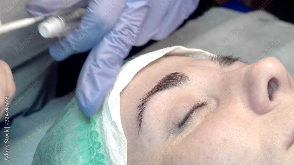 In the eyebrow beauty salon, the master takes care of the eyebrows. Design and coloring styling and lamination of female eyebrows. Color matching. Correction with a cosmetic tool. In the eyebrow beauty salon, the master takes care of the eyebrows. Design and coloring styling and lamination of female eyebrows. Color matching. Correction with a cosmetic tool.