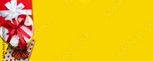 Red gift boxes on a yellow background.Flat lay,copy space