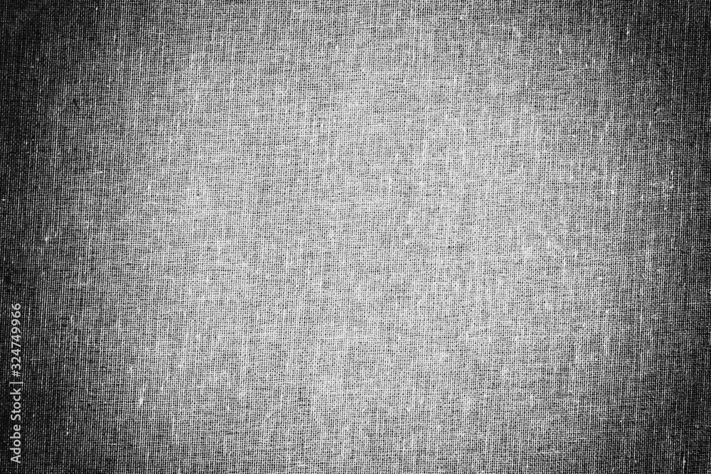 background texture of grey canvas fabric with vignette, black and white photo background texture of grey canvas fabric with vignette, black and white photo
