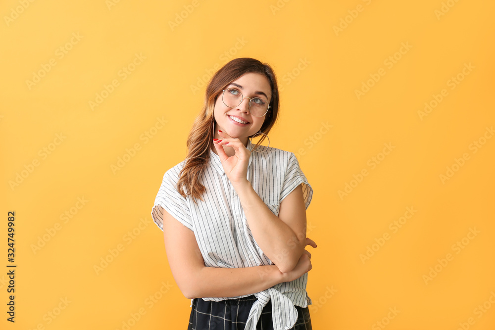 Thoughtful woman with stylish eyeglasses on color background Thoughtful woman with stylish eyeglasses on color background