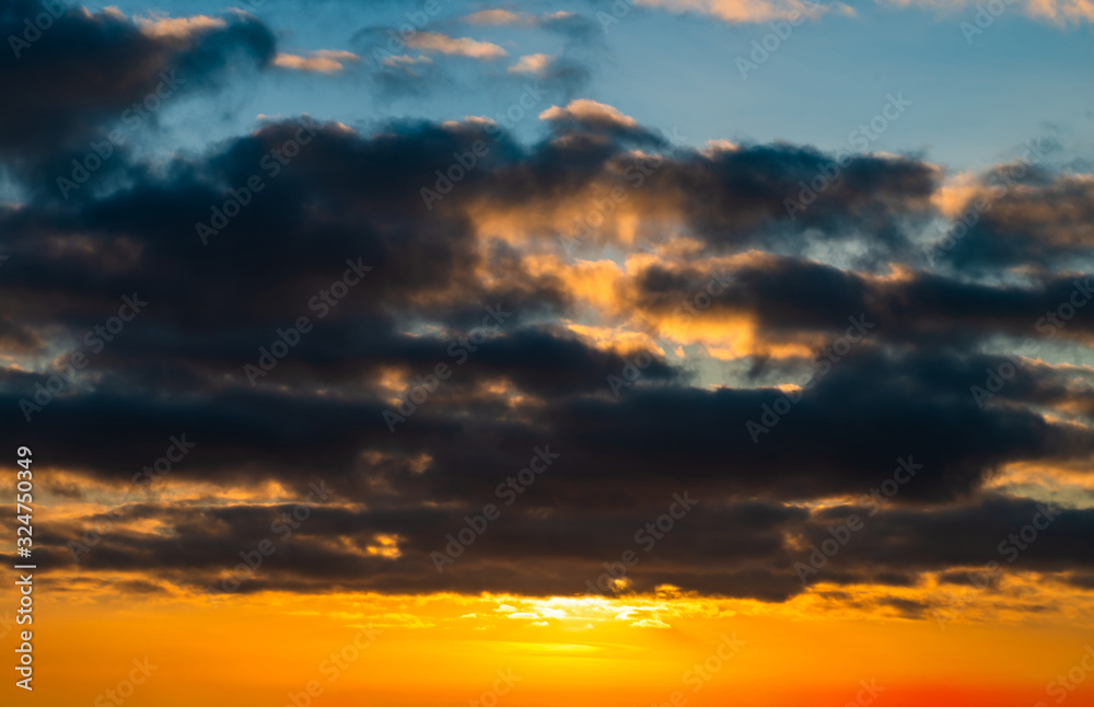 Fototapeta premium Fantastic dark thunderclouds at sunrise
