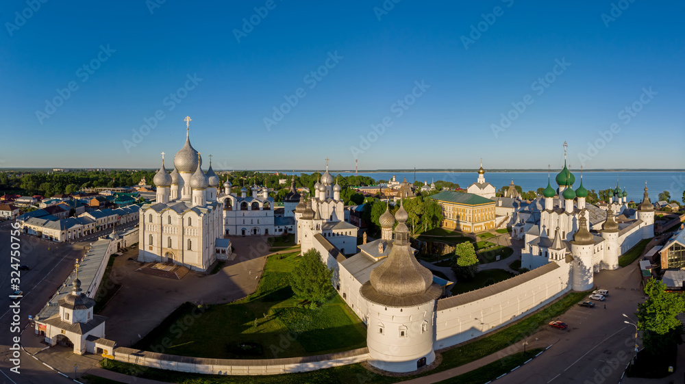 Rostov Kremlin area and Nero lake at sunset. Popular tourist route Golden Ring of Russia. Panoramic aerial view