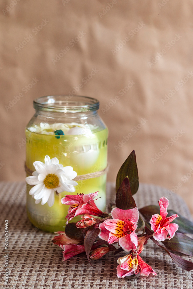 Colorful spring flower and jar full with easter eggs. Top view. From above Colorful spring flower and jar full with easter eggs. Top view. From above