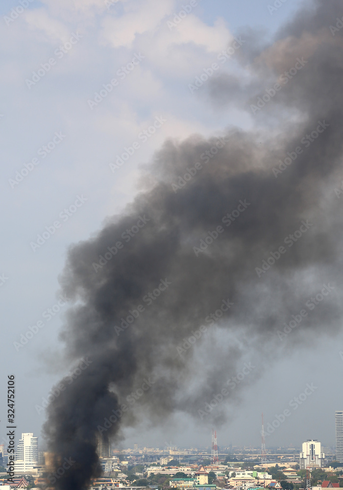 Air pollution with black smoke floating in bangkok city.