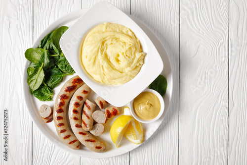 Cheesy whipped potato aligot with pork sausages