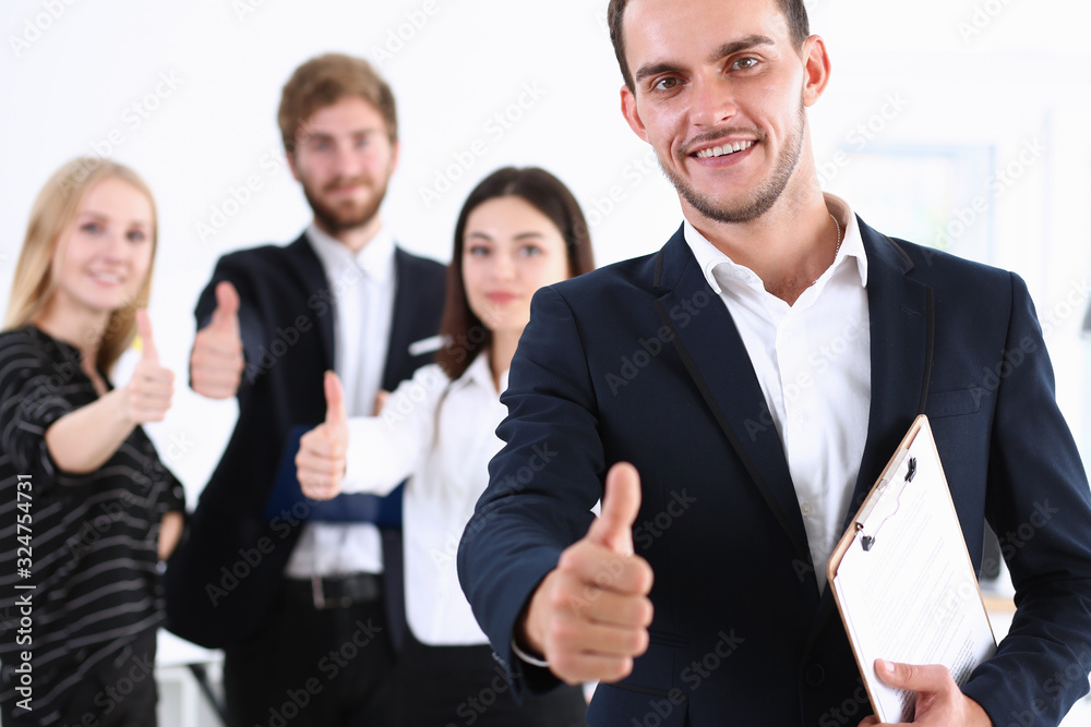 Group of people show ok or confirm with thumb up during conference closeup. High level quality product serious offer excellent education mediation solution creative advisor participation concept Group of people show ok or confirm with thumb up during conference closeup. High level quality product serious offer excellent education mediation solution creative advisor participation concept