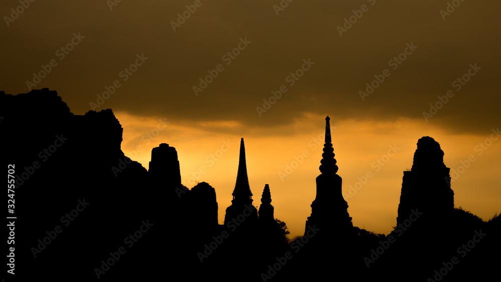 The scenery of Wat Mahathat temple in silhouette look in Ayutthaya, Thailand.