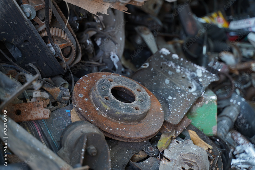 Junk yard full of car's part , engine , body.