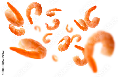 Boiled prawns levitate on a white background photo