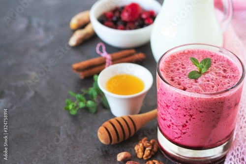 Berry fruits smoothie with vegan milk and honey, summer dessert for well being and healthy lifestyle