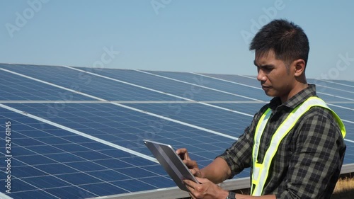 Engineers and workers are inspecting solar cells.