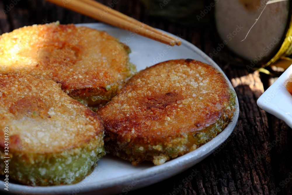 Vietnamese traditional food for Tet, delicious fried glutinous rice cake on plate Vietnamese traditional food for Tet, delicious fried glutinous rice cake on plate