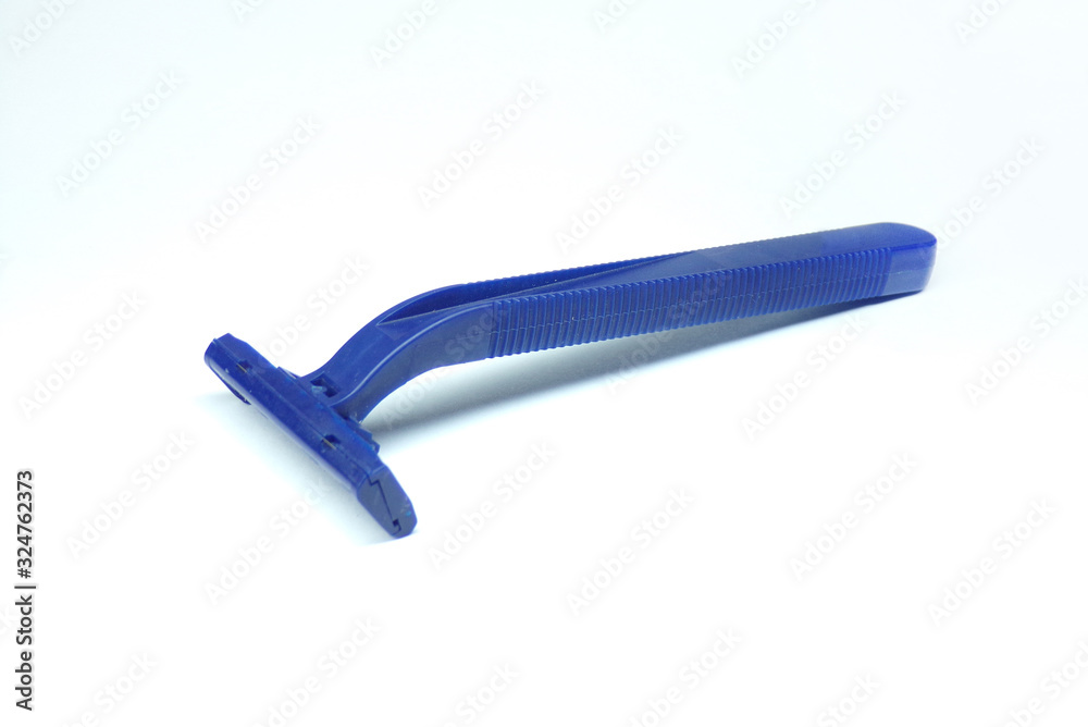 Disposable razor isolated on a white background. Razor for shaving leg hair. The razor is blue as a template. Disposable razor isolated on a white background. Razor for shaving leg hair. The razor is blue as a template.