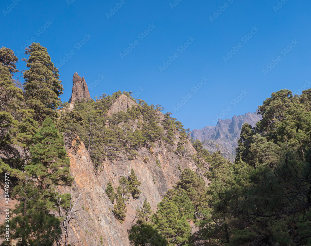 View on Roque Idafe, rock formation at ravine of the Barranco de las Angustias canyon at hiking trail Caldera de Taburiente, La Palma, Canary Islands, Spain