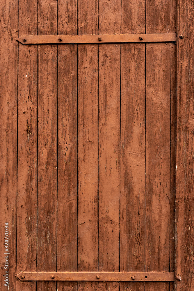 Naklejka premium Wom weather damaged wooden door