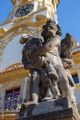 Photography PRAGUE, CZECH REPUBLIC - OCTOBER 14, 2018: The baroque angel before facade of Loreto church  - designed by Kilian Ignac (1772)